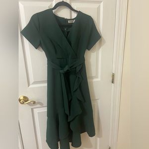 Green dress with ruffle detail on bottom size small